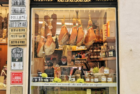 Bobbio - hanging hams shown in an historical shop