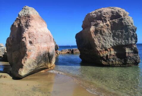 Cala Geniò - San Pietro Island - Two pink sea stacks