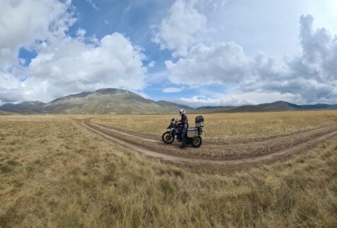 Off-road with motorbike at Castelluccio di Norcia Plateau