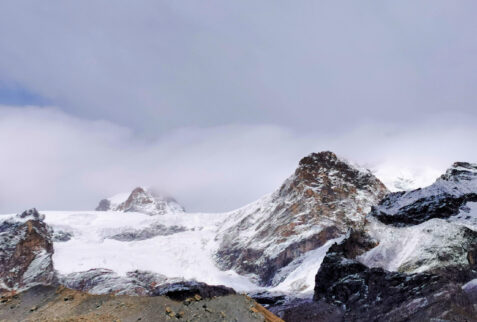 Val d’Ayas Monte Rosa – a glimpse on the glacier and in the background covered by clouds the Breithorn peak (4159 meters)