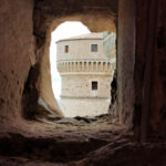 Fortezza di San Leo – a tower seen through a fire mouth – BBofItaly